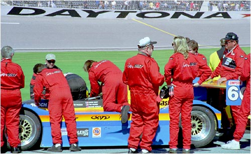 The crew prepares the car on the grid